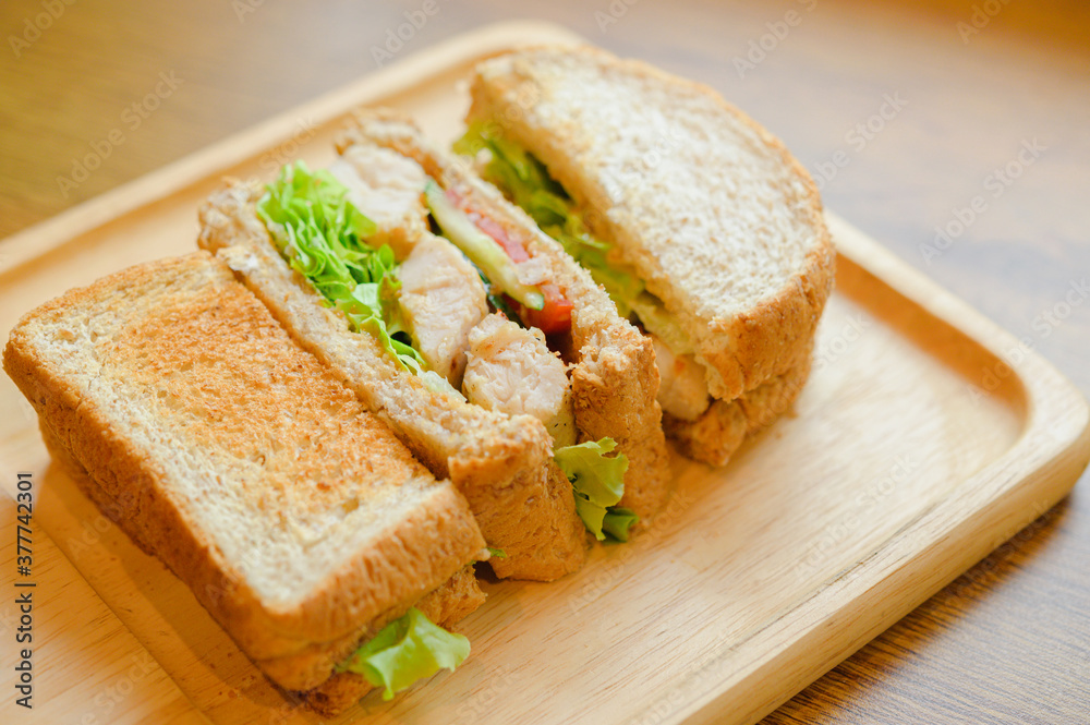 Healthy sandwich with whole grain bread, tomato, lettuce, onion, pepper and chicken. Healthy sandwich with whole grain bread, tomato, lettuce, onion, pepper and chicken.