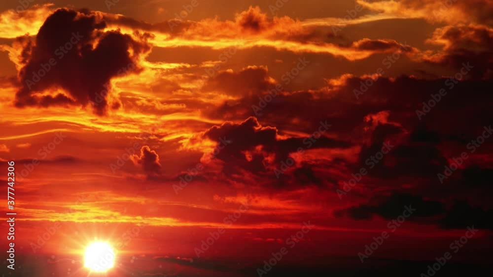 the sun begins to set or appears behind clouds, sunset or sunrise the sun begins to set or appears behind clouds, sunset or sunrise