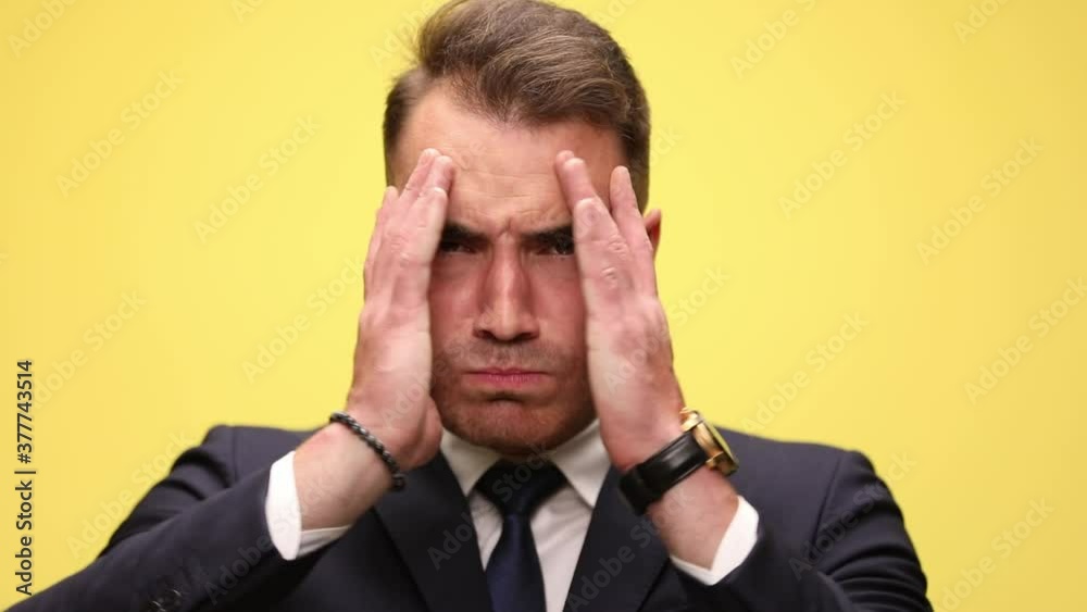 businessman being shocked, slapping his face, opening his hands and having an angry face then a surprised one, covering again, lifting hands and making a happily surprised face businessman being shocked, slapping his face, opening his hands and having an angry face then a surprised one, covering again, lifting hands and making a happily surprised face