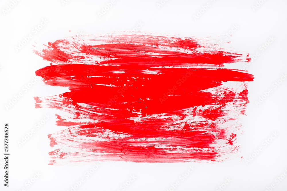 Red abstract stroke on a white background. Colorful raster gouache brush strokes