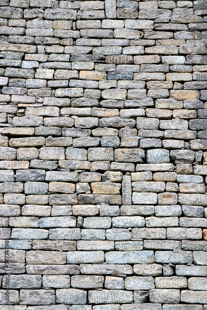 Close-up of stone wall use for construction business and designers. Stone backgrounds textured pattern abstract image. Seamlessly tiling stone wall background texture. A stone wall texture background. Close-up of stone wall use for construction business and designers. Stone backgrounds textured pattern abstract image. Seamlessly tiling stone wall background texture. A stone wall texture background.