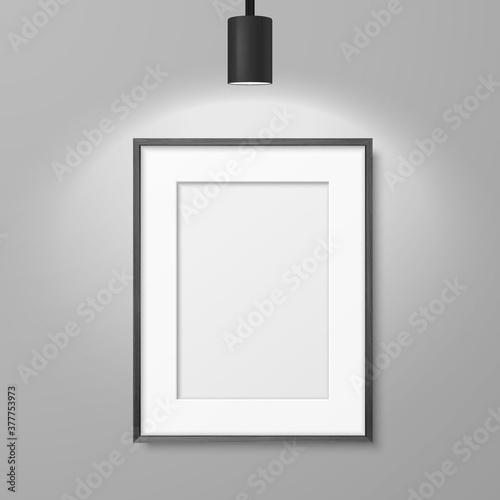 Vector 3d Realistic A4 Black Wooden Simple Modern Frame for Presentstion on a White Wall Background with a Luminous Spot Lamp on Top, Above Frame. Design Template for Mockup, Front View