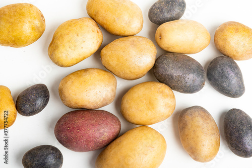 Assorted Color Potatoes On Flat White Surface Table