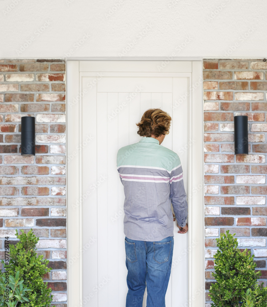 Man opening the door .Inviting the guests Man opening the door .Inviting the guests