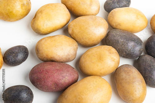 Assorted Color Potatoes On Flat White Surface Table
