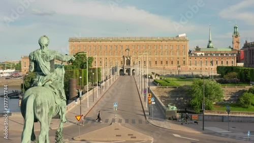 Stockholm palace and statue drone view. People tourists passing by. Norrbro photo