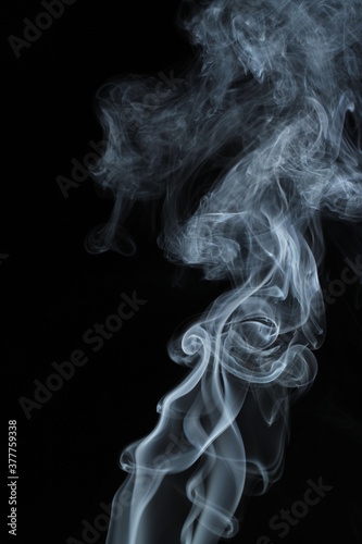 Fototapeta Naklejka Na Ścianę i Meble -  White smoke from incense on a black background
