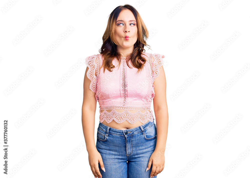 Obraz premium Young beautiful caucasian woman wearing casual clothes making fish face with lips, crazy and comical gesture. funny expression.