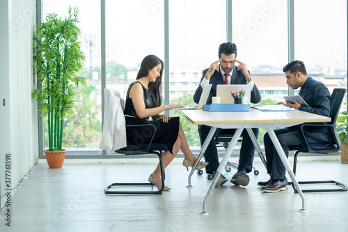 Group of business people working together and brainstorming at modern office. © visoot