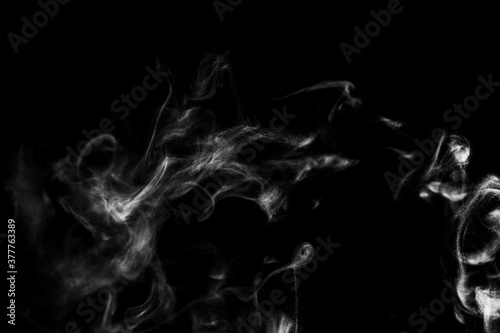 White natural steam smoke effect on solid black background with abstract blur motion wave swirl use for overlay in pollution, vapor cigarette, gas, dry ice, hot food, boil water 