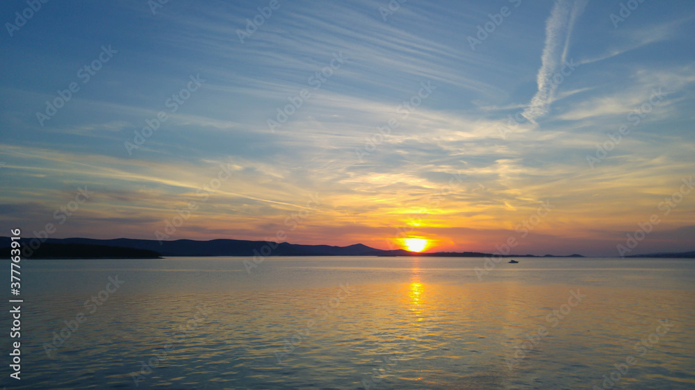 Peaceful sunset with mountain in the background. Beautiful views in Croatia.