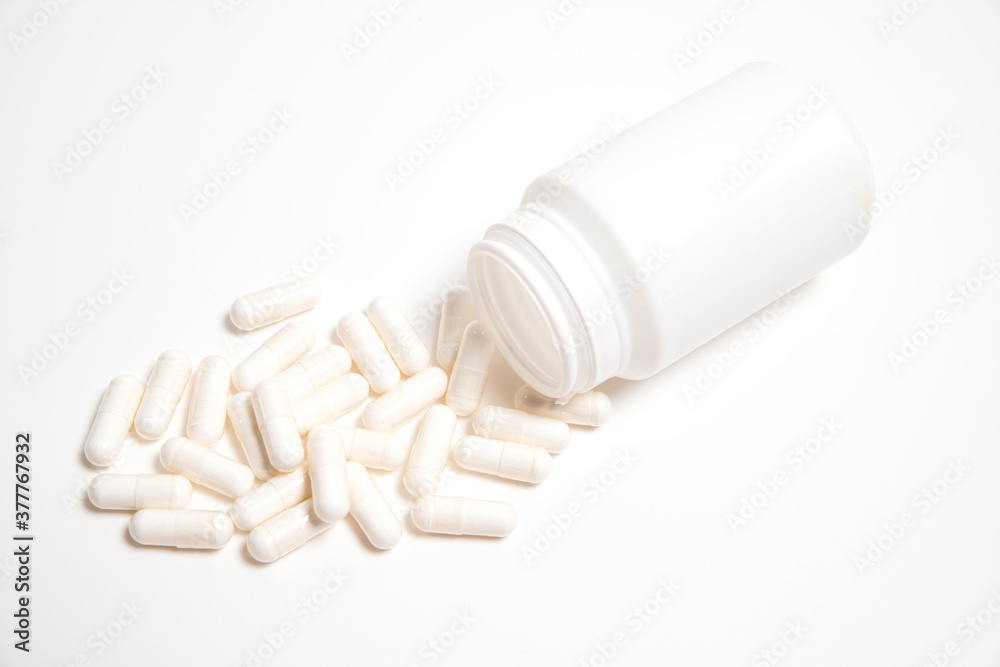 white pills and white bottle white pills and white bottle