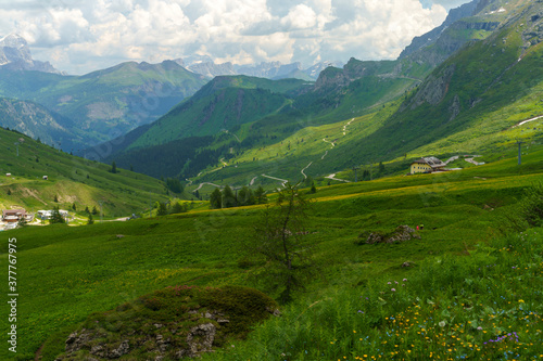 Fototapeta Naklejka Na Ścianę i Meble -  Mountain landscape along the road to Pordoi pass, Dolomites