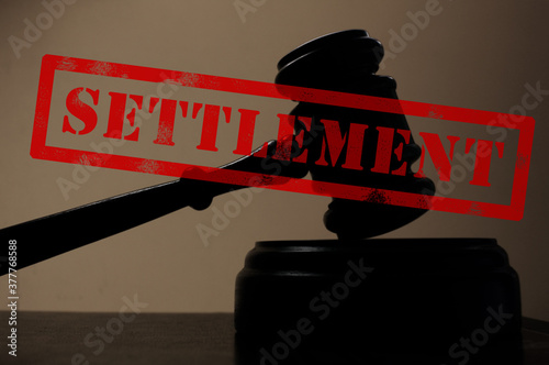 judge legal gavel with Settlement stamp