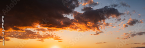 Summer sunset sky high resolution panorama with fleece colorful clouds. Evening dusk good weather natural background. © wildman