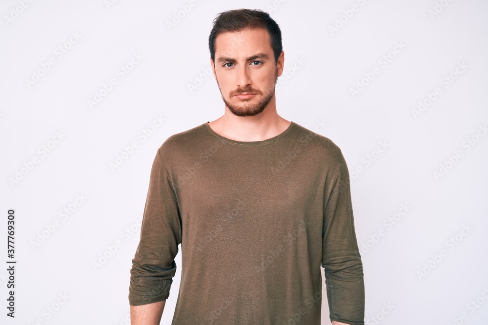 Young handsome man wearing casual clothes skeptic and nervous, frowning upset because of problem. negative person. Young handsome man wearing casual clothes skeptic and nervous, frowning upset because of problem. negative person.