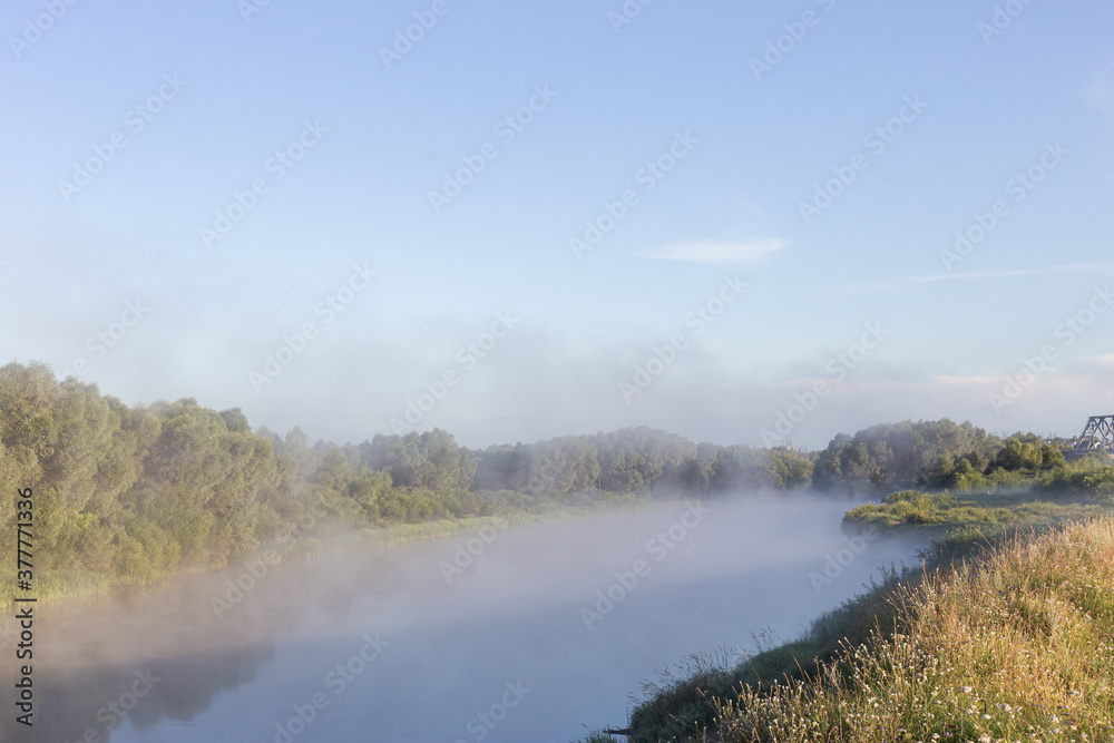 fog over the river at dawn fog over the river at dawn