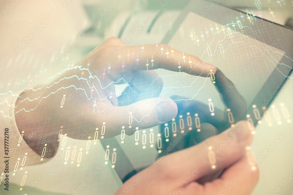 Multi exposure of man's hands holding and using a phone and financial chart drawing. Market analysis concept. Multi exposure of man's hands holding and using a phone and financial chart drawing. Market analysis concept.