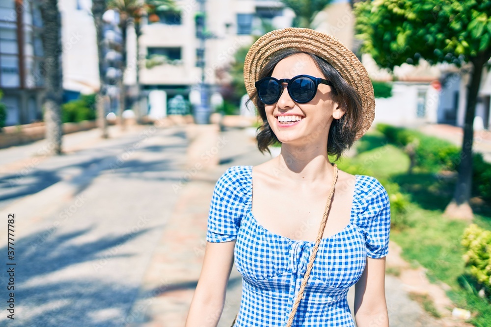 Young beautiful girl smiling happy walking at street of city Young beautiful girl smiling happy walking at street of city
