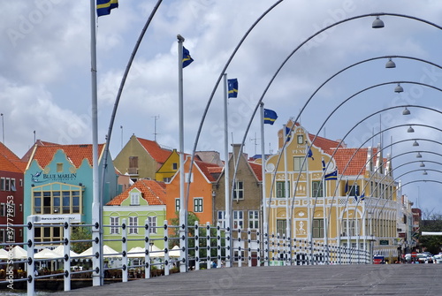 View of pastel buildings through the Queen Emma pontoon bridge in Curacao photo