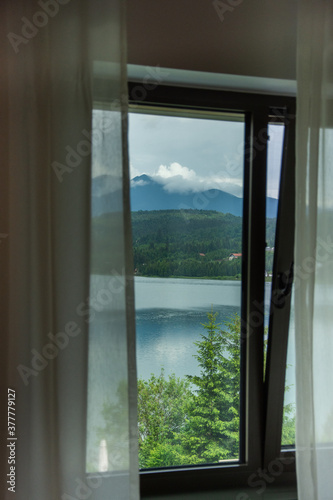 Bistrita  ROMANIA  2020  View of Colibita Lake through the window