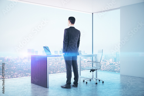 Young businessman standing in board room photo