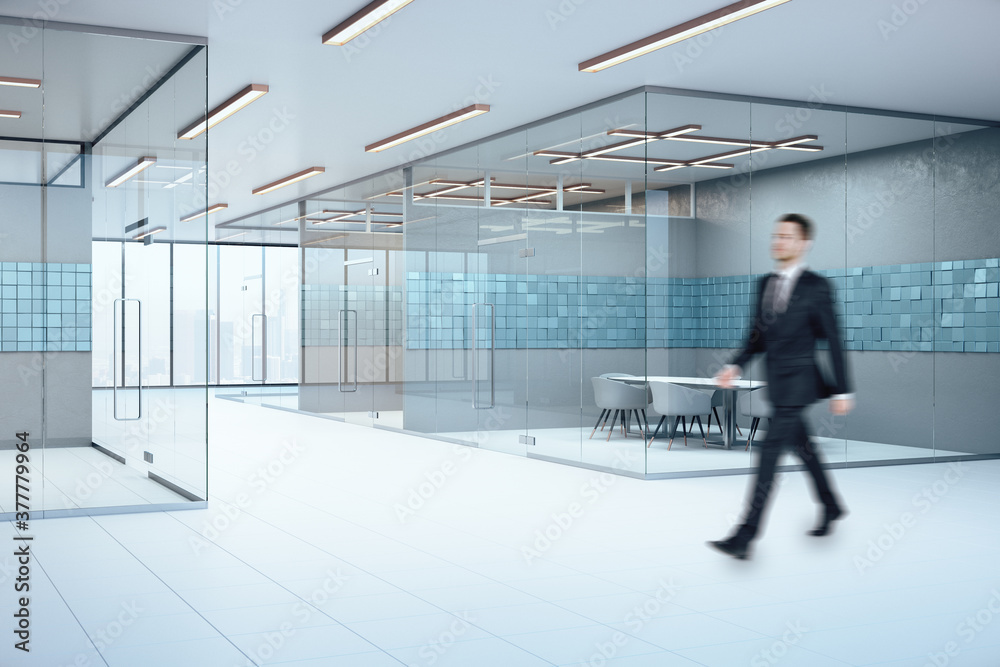Businessman walking in conference interior with abstract blue tiles Businessman walking in conference interior with abstract blue tiles