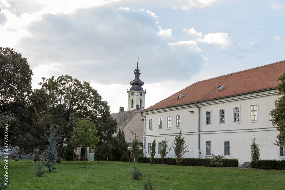 SREMSKA MITROVICA, SERBIA - SEPTEMBER 24, 2016: Panorama of the istorijski arhiv, the national archive, and the Vmuc Dimitrije orthodox church in Sremska Mitrovica, in the city center