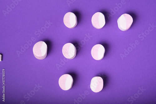 pattern of marshmallows on a purple background