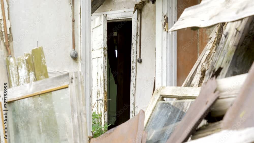 The look of the ruined wooden house with the falling woods The look of the ruined wooden house with the falling woods