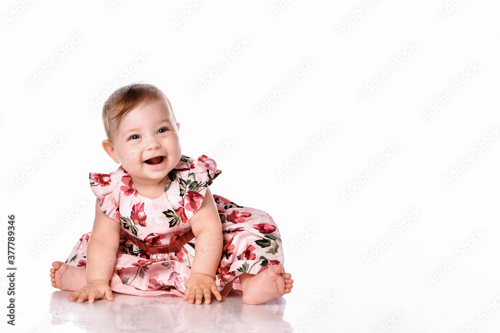 Pretty baby in beautiful dress sitting on floor Pretty baby in beautiful dress sitting on floor