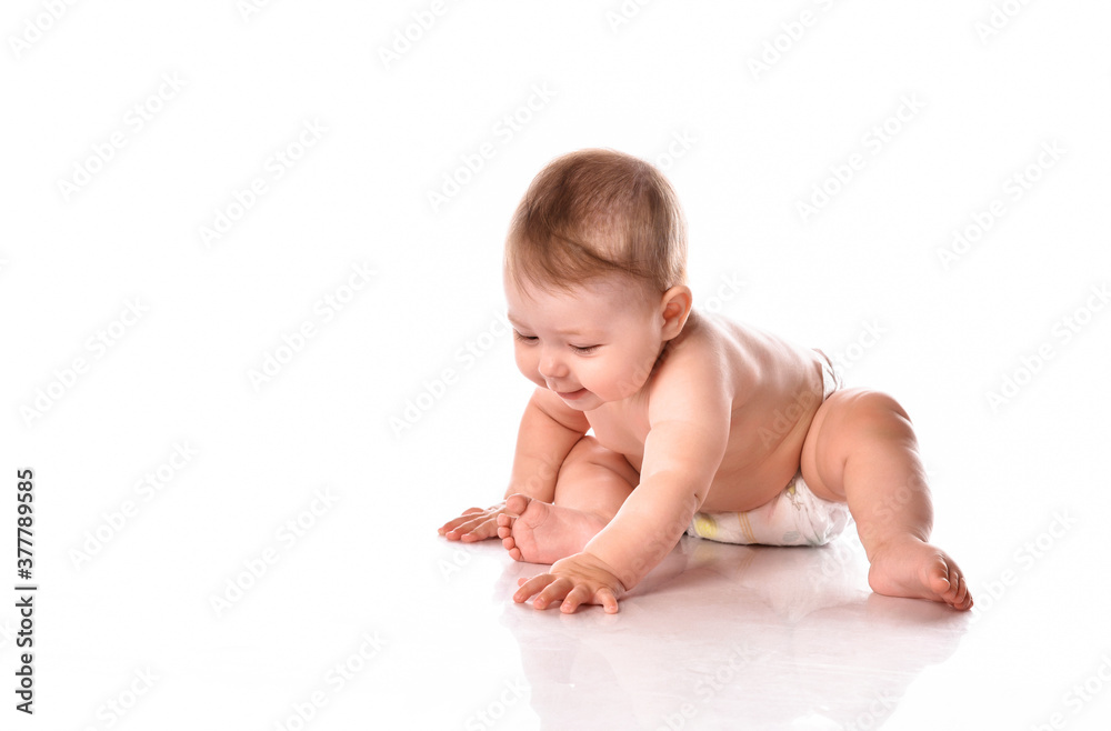 Little baby playing on floor over white background Little baby playing on floor over white background