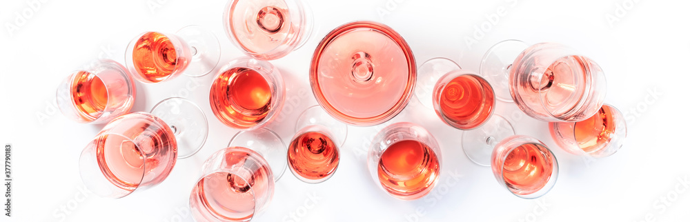 Rose wine glasses on wine tasting. Degustation different varieties of pink wine concept. White background, top view, hard light Rose wine glasses on wine tasting. Degustation different varieties of pink wine concept. White background, top view, hard light