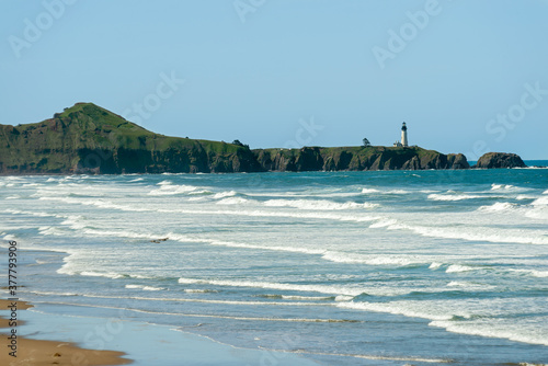 The Yaquina Head Lighthouse seen from Beverly Beach State Park near Newport, Oregon, USA photo