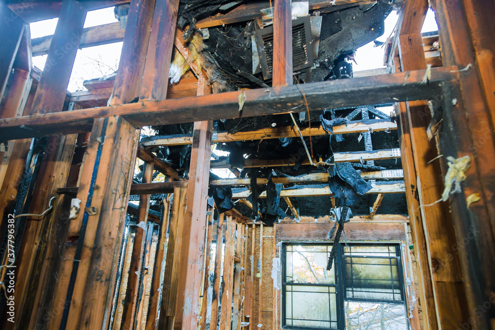 Interior of a burned wooden beams an apartment building in California Interior of a burned wooden beams an apartment building in California