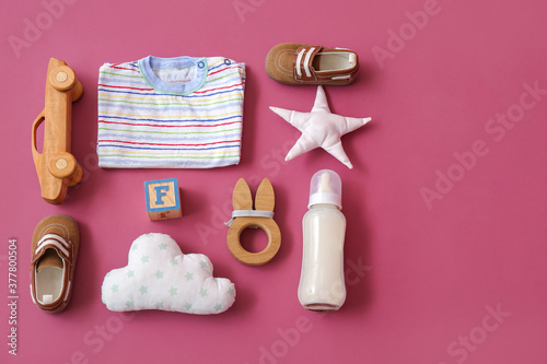 Set of baby accessories on color background