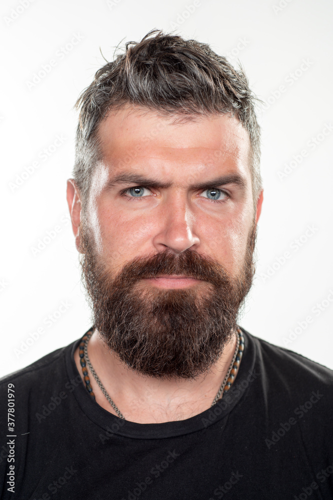 Hipster guy models in studio. Bearded man with long beard and moustache in barbershop. Hipster guy models in studio. Bearded man with long beard and moustache in barbershop.