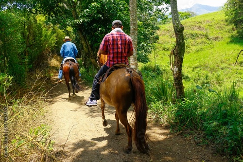 Amaga, Antioquia / Colombia. March 31, 2019. People riding horse in street