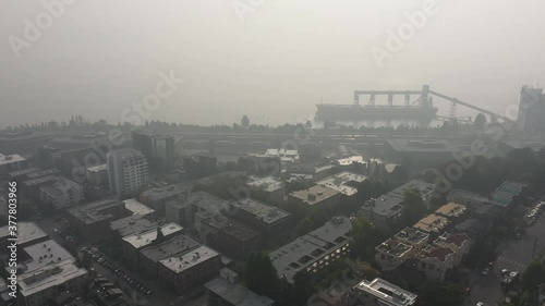 Aerial / drone footage of the thick smoke over the waterfront, Belltown, Elliott Bay, Puget Sound with smoke in the air from the Washington State wildfires in Seattle, Washington photo