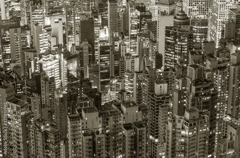 Aerial view of crowded high rise building in Hong Kong city at night