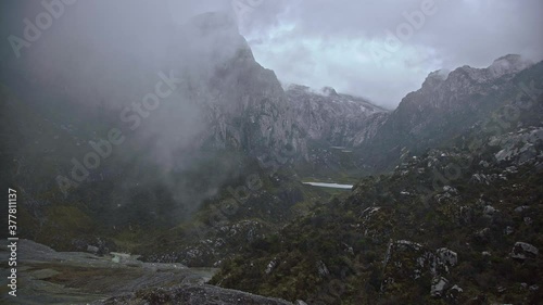 Time lapse of hazy Mountain Carstensz Jayawijaya Sudirman mountain range with moving clouds photo