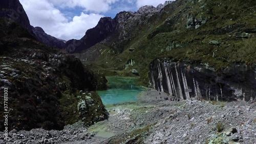 Calm green lake between hills on Mount Carstensz area, Sudirman mountain range, Papua, Indonesia HD Stock Footage Video photo