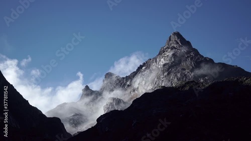 Mount Carstensz covered with clouds HD Stock Footage Video photo
