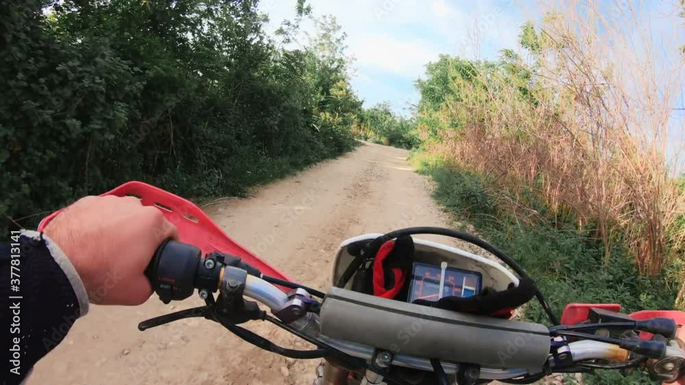 Offroad bike riding on dirt track, point of view Offroad bike riding on dirt track, point of view