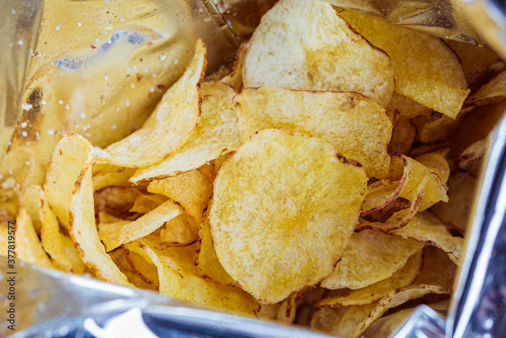 Traditional potato chips in bag. Fast food concept. Traditional potato chips in bag. Fast food concept.