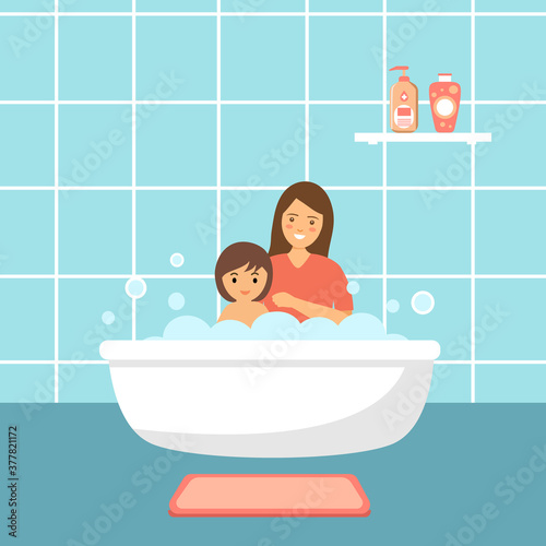 Baby taking bath playing with mother. Little child in bathtub. Smiling kids in bathroom with foam. 