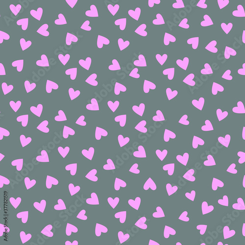 Pink small hearts on a gray background. Pretty pattern in pastel tones. Tender colors.