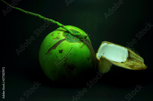 Art background coconut, banana, spoon, dish