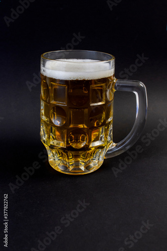 photo mugs of beer on a black background, Oktoberfest