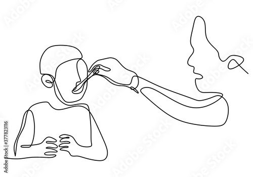 One single line drawing of young mother is giving food to his toddler boy on dining table. Happy parenting concept isolated on white background. Vector hand draw design illustration